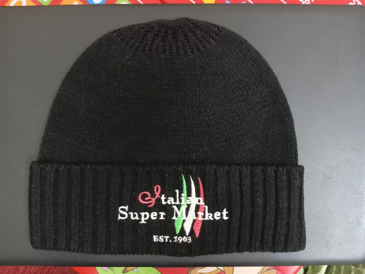 Black hat with colorful skull logo